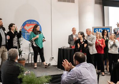 Meredith Elbaum, Executive Director, announces the rebranding of USGBC MA at the 2019 Green Building Showcase.