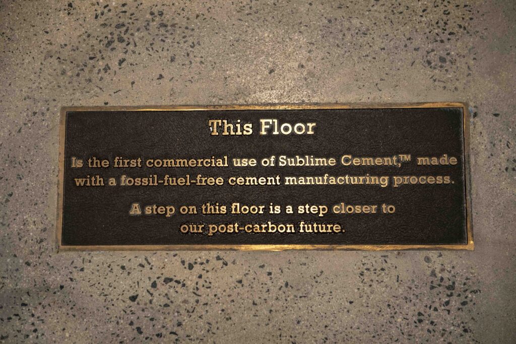 Sublime Cement plaque - This Floor is the first commercial use of Sublime Cement, made with a fossil-fuel-free cement manufacturing process. A step on this floor is a step closer to our post-carbon future.